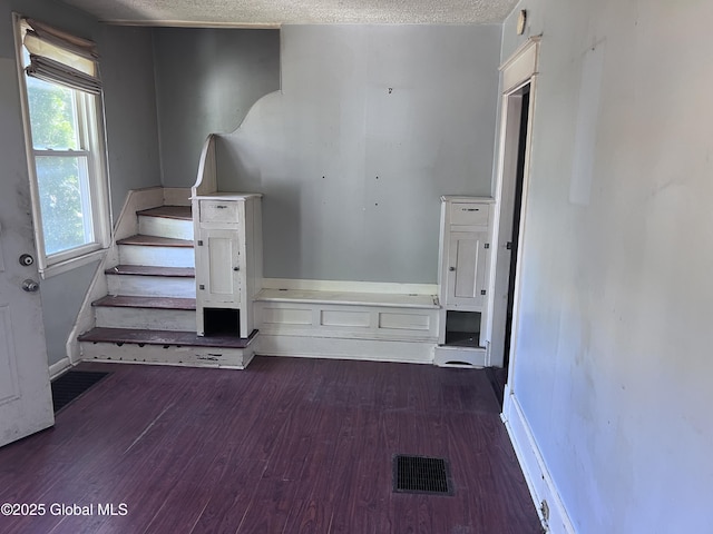 4 Wesley Ave, Schenectady, NY 12304 - unfurnished bedroom featuring baseboards, a textured ceiling, visible vents, and wood finished floors