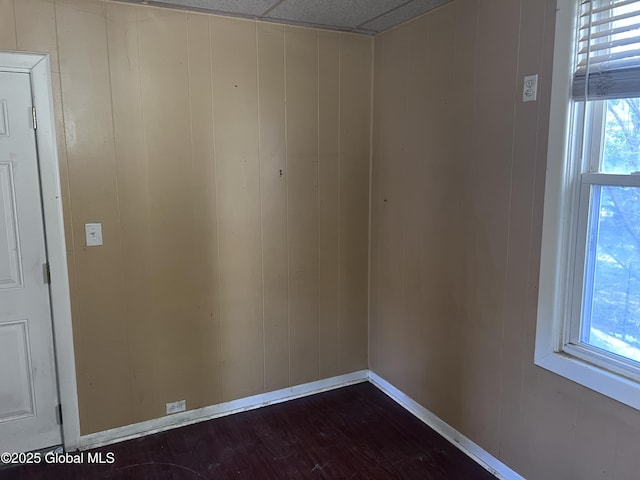 4 Wesley Ave, Schenectady, NY 12304 - empty room with baseboards, a healthy amount of sunlight, and dark wood-type flooring