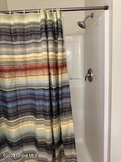 bathroom with a shower with curtain