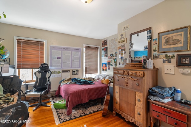 bedroom with wood finished floors
