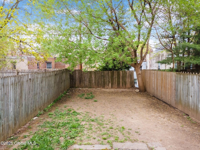 view of yard featuring a fenced backyard