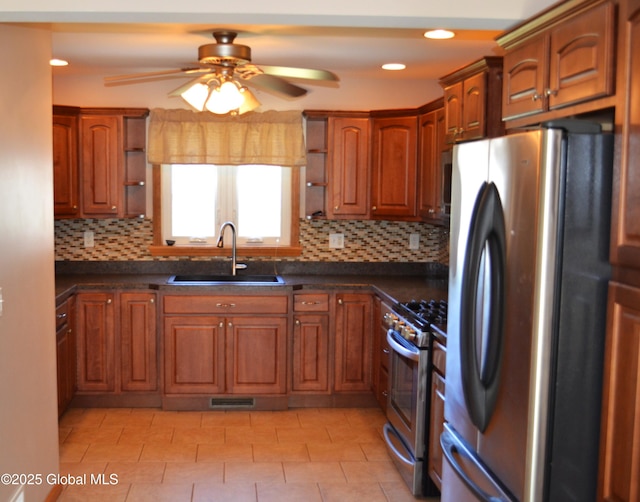kitchen featuring appliances with stainless steel finishes, ceiling fan, open shelves, and a sink