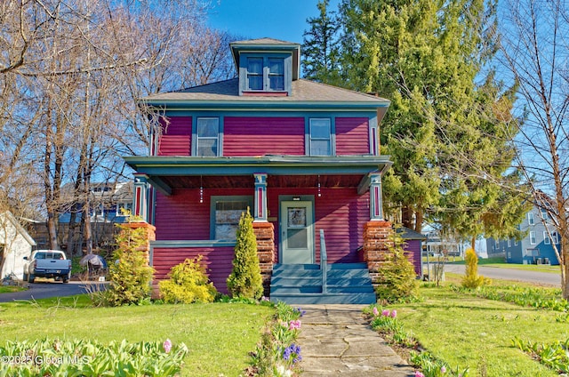 18 1st Ave, Mayfield, NY 12117 - american foursquare style home featuring a shingled roof, covered porch, and a front yard