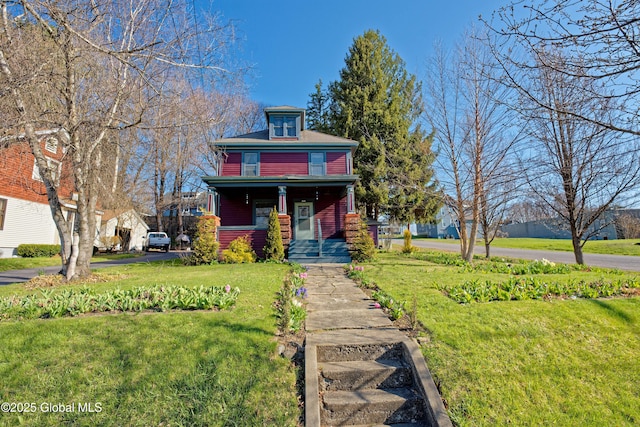 18 1st Ave, Mayfield, NY 12117 - traditional style home featuring a porch and a front lawn