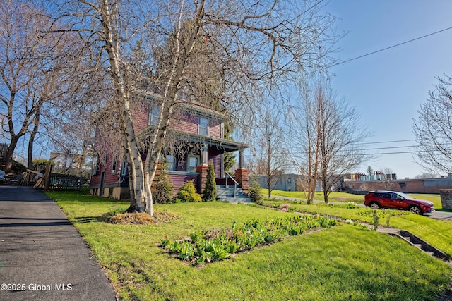 18 1st Ave, Mayfield, NY 12117 - view of front of property featuring covered porch and a front lawn