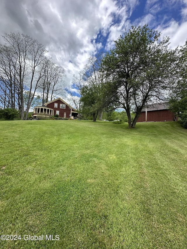 71 S Rd, Hampton, NY 12887 - view of green lawn with an outdoor structure