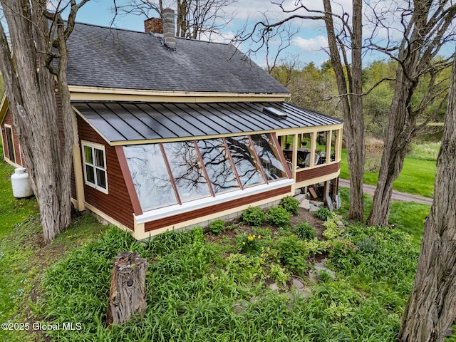 71 S Rd, Hampton, NY 12887 - view of side of home featuring a shingled roof, a standing seam roof, metal roof, and a chimney