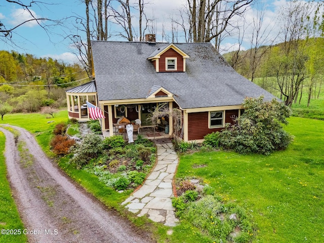 71 S Rd, Hampton, NY 12887 - view of front of property with a chimney, a front lawn, and a shingled roof