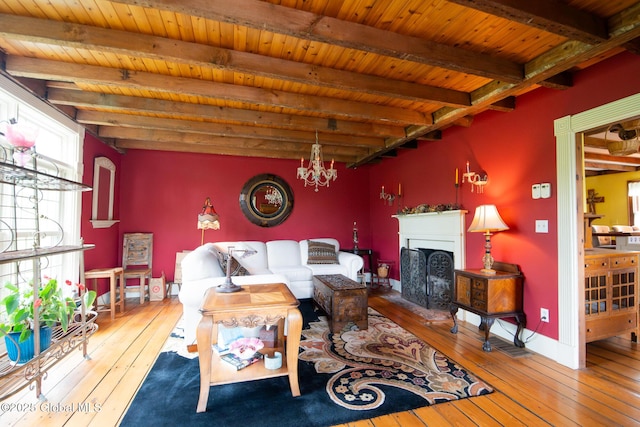 71 S Rd, Hampton, NY 12887 - living room with hardwood / wood-style floors, beamed ceiling, a chandelier, a fireplace, and wooden ceiling