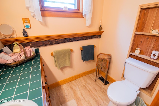 71 S Rd, Hampton, NY 12887 - bathroom featuring toilet and baseboards