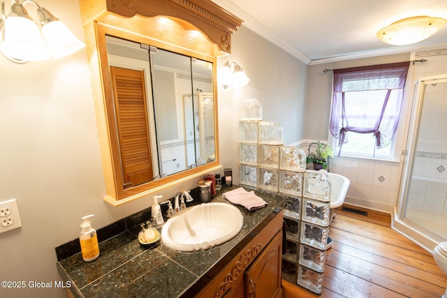 71 S Rd, Hampton, NY 12887 - full bathroom with a shower stall, hardwood / wood-style flooring, crown molding, and vanity