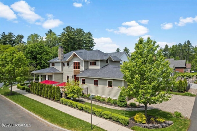 20 Oak Ridge Blvd, Saratoga Springs, NY 12866 - view of front of property featuring roof with shingles and a chimney