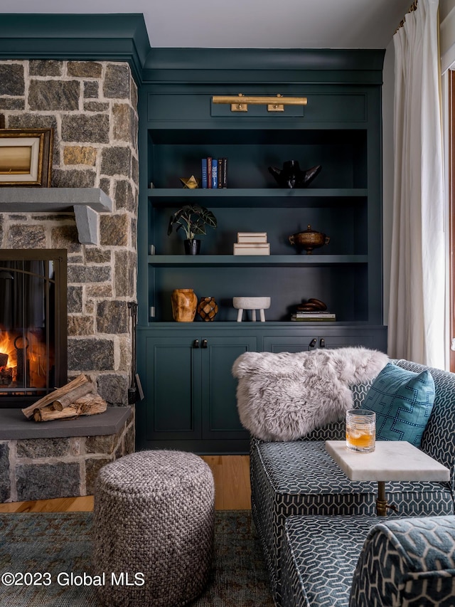 20 Oak Ridge Blvd, Saratoga Springs, NY 12866 - living area featuring a fireplace, built in shelves, and wood finished floors