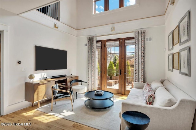 20 Oak Ridge Blvd, Saratoga Springs, NY 12866 - sitting room with a towering ceiling, visible vents, french doors, and wood finished floors