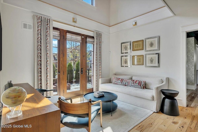 20 Oak Ridge Blvd, Saratoga Springs, NY 12866 - living area with visible vents, french doors, and hardwood / wood-style floors