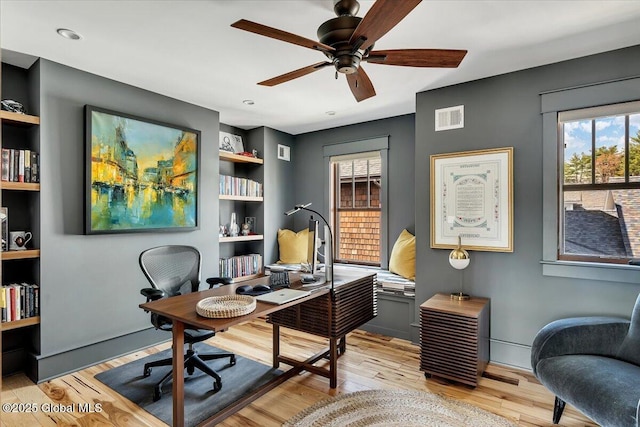 20 Oak Ridge Blvd, Saratoga Springs, NY 12866 - office space featuring built in shelves, ceiling fan, light wood-style flooring, and visible vents
