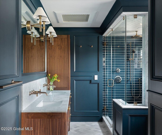 20 Oak Ridge Blvd, Saratoga Springs, NY 12866 - bathroom with visible vents, a stall shower, a notable chandelier, and vanity