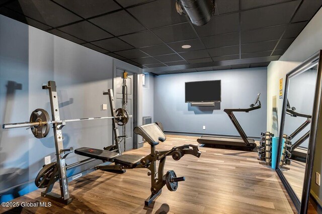 20 Oak Ridge Blvd, Saratoga Springs, NY 12866 - exercise area featuring baseboards, a drop ceiling, and wood finished floors