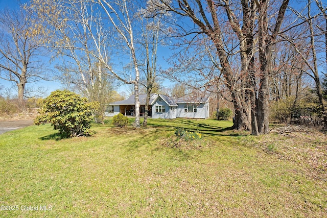 ranch-style house with a front yard
