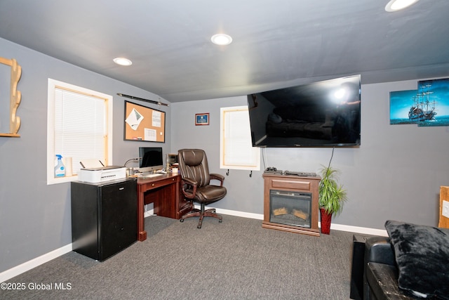 carpeted office with recessed lighting, baseboards, and a glass covered fireplace