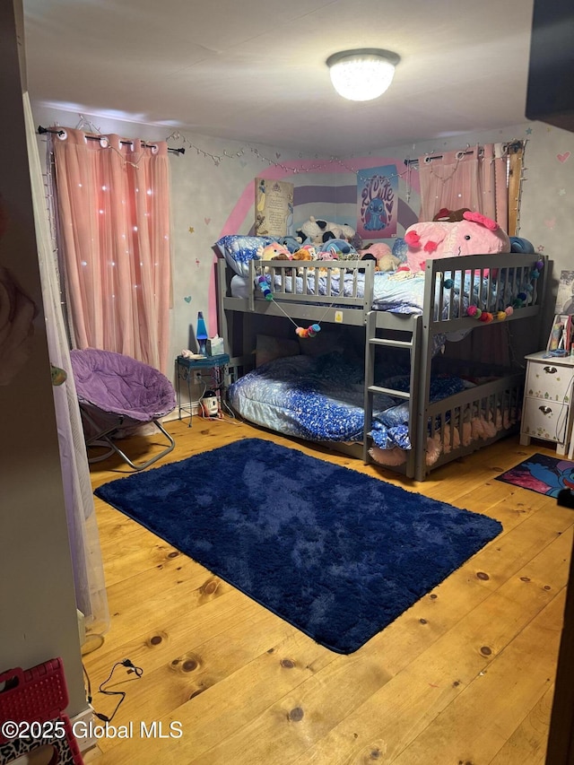bedroom with wood finished floors