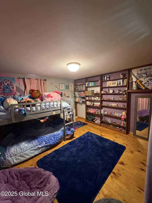 bedroom featuring wood finished floors