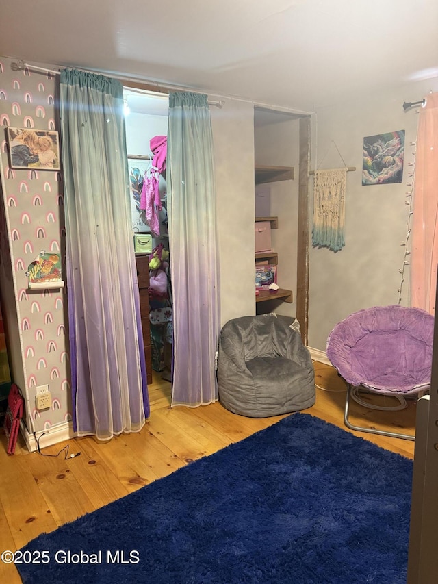 bedroom with wood finished floors
