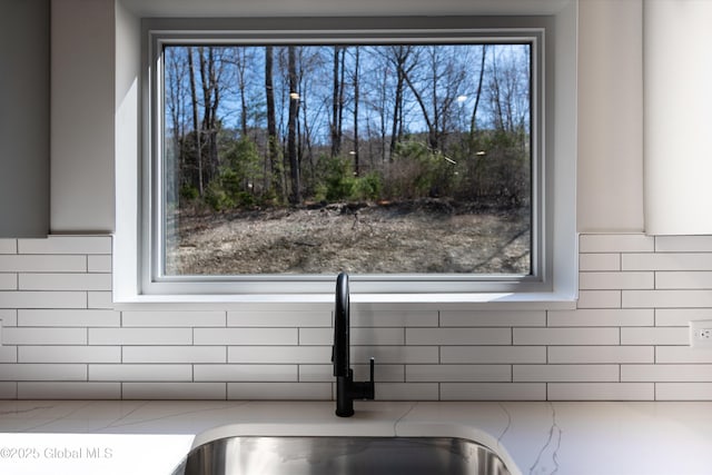 room details with a sink and decorative backsplash
