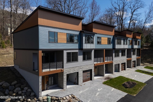 exterior space featuring driveway and a garage