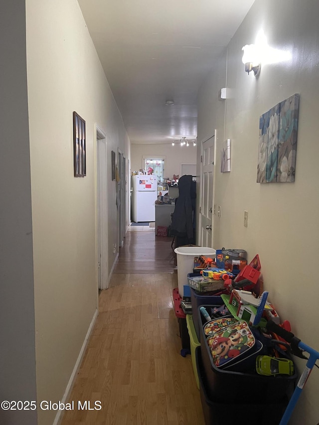 corridor with light wood-style flooring