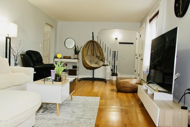 28 Puritan Dr, Rotterdam, NY 12306 - living room with light wood-style floors, arched walkways, and stairway