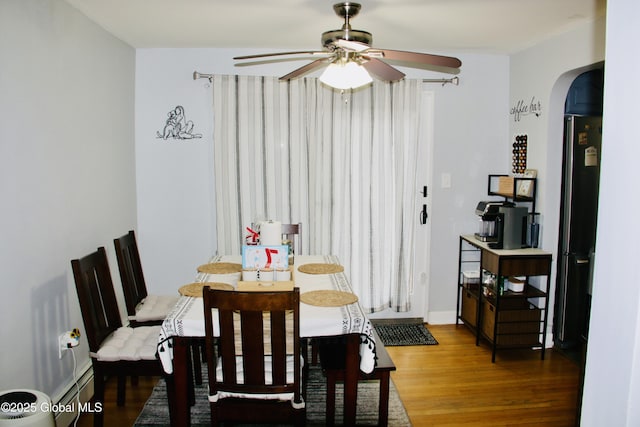 28 Puritan Dr, Rotterdam, NY 12306 - dining area featuring a ceiling fan, arched walkways, and wood finished floors