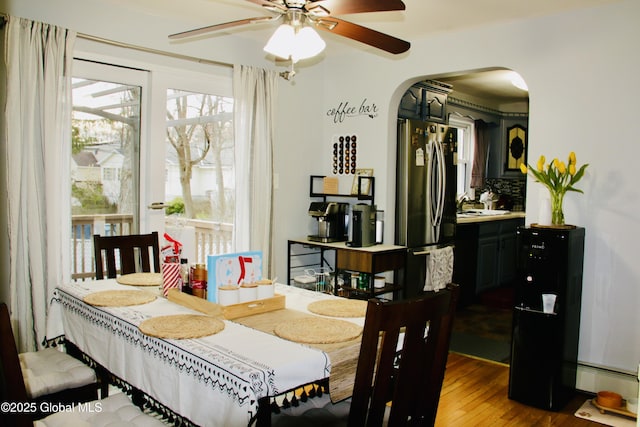 28 Puritan Dr, Rotterdam, NY 12306 - dining area with arched walkways, a ceiling fan, and wood finished floors