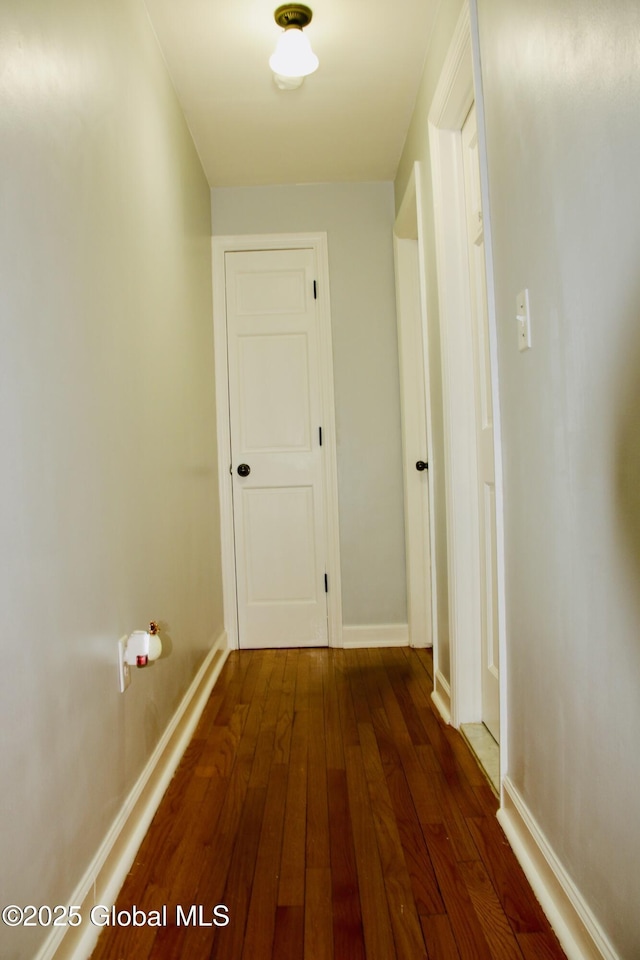 28 Puritan Dr, Rotterdam, NY 12306 - hallway with baseboards and dark wood-type flooring