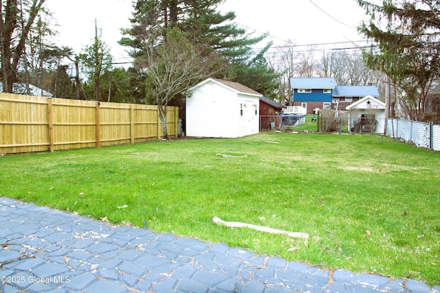 28 Puritan Dr, Rotterdam, NY 12306 - view of yard with a storage shed, an outbuilding, and a fenced backyard