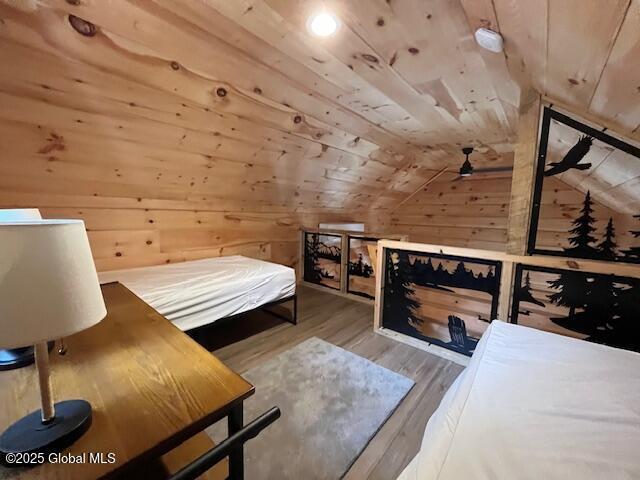 15-17 Pine Rd, Lake Luzerne, NY 12846 - bedroom with wood ceiling, wood walls, wood finished floors, and lofted ceiling