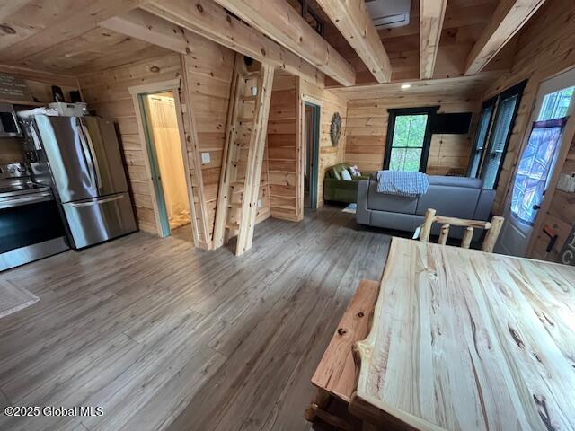 15-17 Pine Rd, Lake Luzerne, NY 12846 - living area featuring wooden walls, wood ceiling, and wood finished floors