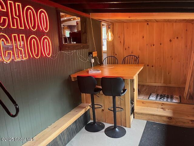 15-17 Pine Rd, Lake Luzerne, NY 12846 - dining space with wooden walls and indoor bar
