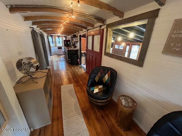 15-17 Pine Rd, Lake Luzerne, NY 12846 - hall featuring wood walls, wood finished floors, and beamed ceiling