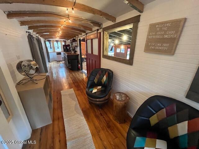 15-17 Pine Rd, Lake Luzerne, NY 12846 - hallway with washer / clothes dryer, beam ceiling, wood walls, and wood finished floors