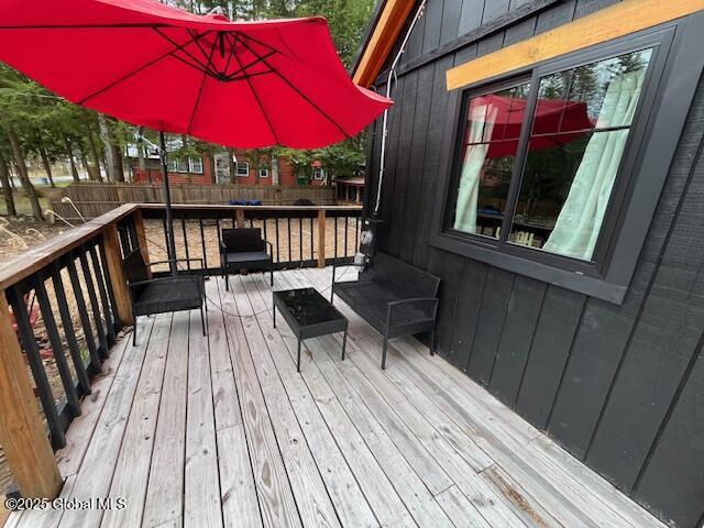 15-17 Pine Rd, Lake Luzerne, NY 12846 - wooden deck featuring fence