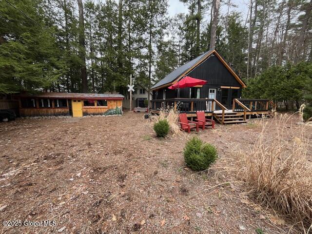 15-17 Pine Rd, Lake Luzerne, NY 12846 - rear view of house featuring a wooden deck