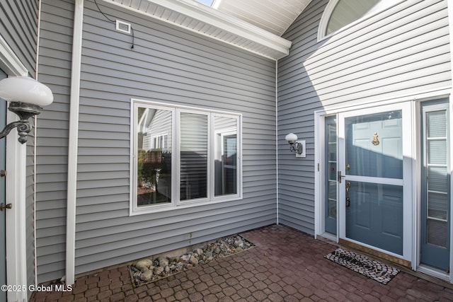 doorway to property with a patio
