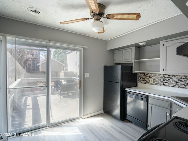 kitchen featuring open shelves, freestanding refrigerator, light wood-type flooring, dishwasher, and gray cabinetry