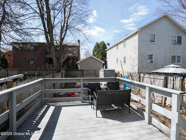 deck with a fenced backyard