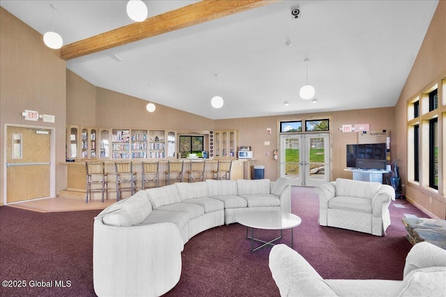 living area featuring beamed ceiling, french doors, carpet, and high vaulted ceiling