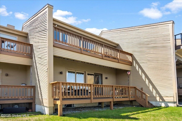 rear view of house featuring a balcony