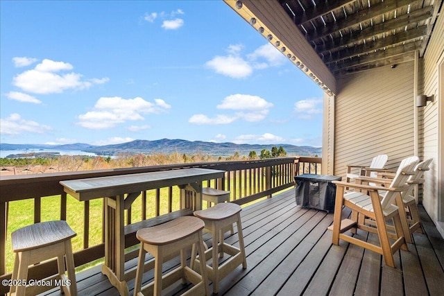 wooden terrace featuring a mountain view