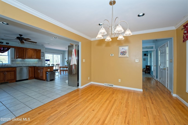 37 Old Hickory Rd, Brunswick, NY 12180 - unfurnished dining area featuring ceiling fan with notable chandelier, a sink, baseboards, light wood-style floors, and ornamental molding