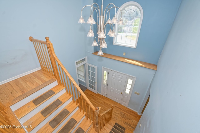 37 Old Hickory Rd, Brunswick, NY 12180 - foyer entrance with a notable chandelier, baseboards, wood finished floors, stairway, and a high ceiling